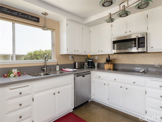 Efficient, well-laid out kitchen has plenty of storage and stainless steel appliances.