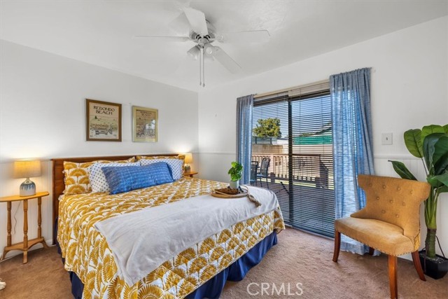 larger of the 3 bedrooms with backyard access