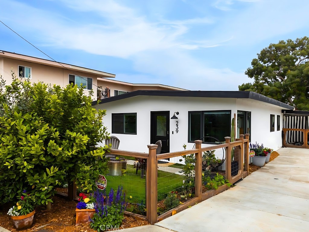 Situated in the heart of the vibrant coastal community of San Clemente, this quintessential 1950s bungalow-style duplex stands as
the epitome of modern comfort fused with timeless charm. This space offers an inviting retreat for those seeking the perfect blend of character and
contemporary living. Step inside #A, and you'll immediately be greeted by the light and bright interior, where a Dutch door and large windows allow the coastal sunshine to flood every corner of the living room and kitchen. The kitchen opens up seamlessly to the living space perfect for entertaining
guests - featuring a quaint breakfast bar. The atmosphere is both cozy and sophisticated, thanks to meticulously chosen modern finishes that
seamlessly complement the bungalow's original features. The two bedrooms are generously sized and feature mini split heating & cooling systems.
The full bathroom boasts incredible upgrades and a large walk-in shower. In addition, the front yard is fully fenced in and boasts a luscious garden. The rear unit #B, is the private oasis and upon entry you'll be greeted by the abundance of charm, from its unique architectural features and the warm ambiance that fills each room. Sunlight streams through the windows, creating an inviting and cheerful atmosphere throughout. The chef's kitchen is equipped with modern appliances and is designed for both functionality and style. The two bedrooms are generously sized and one features a slider leading to the private patio & outdoor space. The full bathroom boasts an oversized walk-in shower and custom tilework. Moving outside into your fully fenced in private outdoor living space, it creates a serene escape where you can unwind, entertain, and soak in the beauty of the coastal canyon & greenery. The 9,500 sq ft lot encompasses much of the canyon and allows for ample space to plant additional plants or fruit trees. The list of upgrades made to this property is too long to list, but includes: new Milgard windows & sliders, Kitchen Aid appliances, quartz countertops, solid core doors, custom cabinets in both kitchens, Italian porcelain tile flooring, new lighting, and so much more!! Imagine mornings spent strolling along San Clemente’s world famous sandy shores just moments away, and afternoons exploring the vibrant energy of the nearby downtown area along Del Mar.