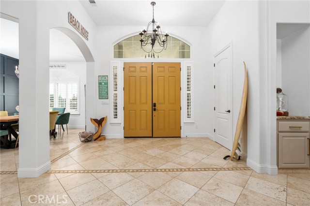 Beautiful open tiled entry with double doors