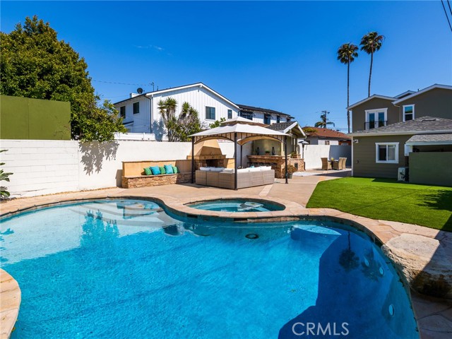 Pool & spa in back of property has its own child gate