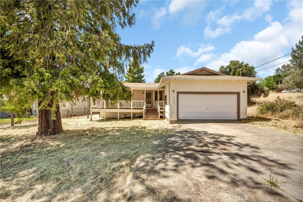 19333 Raven Hill Rd. Hidden Valley Lake, California Charming and affordable in Hidden Valley Lake! Located on a quiet street directly across from Raven Hill Park, this home offers the comfort and convenience you've been searching for. Step inside to discover an inviting interior, freshly painted throughout with new laminate flooring and baseboards. The living room is spacious and bright, perfect for relaxing with loved ones or entertaining guests. A large front window brings in ample natural light and offers pleasant views of the mature trees that surround the property, adding to the home's peaceful ambiance. The kitchen is functional and welcoming, offering ample cabinet space and a layout that makes meal prep a breeze. Whether you're enjoying a casual breakfast or preparing dinner, you'll appreciate the flow and openness of this heart-of-the-home space. Just off the kitchen is a cozy dining area with enough room for a full-sized table, making it ideal for both daily meals and special gatherings. Each of the bedrooms offers a comfortable retreat, complete with new paint and easy access to the recently updated bathrooms, which feature new toilets. The primary bedroom is a relaxing space, with serene views and adjoining bathroom. Step outside to enjoy the fully fenced yard—an ideal setting for pets, children or gardening. The covered front deck is perfect for morning coffee or watching the sunset, while the pergola-covered back deck provides a peaceful setting for outdoor dining or weekend lounging. Living in Hidden Valley Lake means enjoying a host of community amenities, including a private lake with beaches, a golf course, swimming pool, tennis/pickleball courts, horse stables, security, and more. Whether you're looking to relax or stay active, this community has something for everyone. Schedule your showing today!