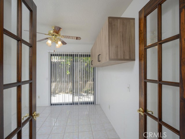 Downstairs secondary bedroom with slider that leads to rear patio/yard