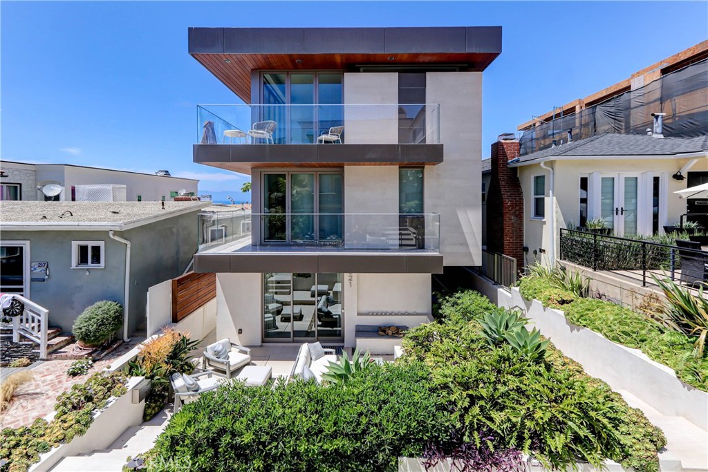 ***This property is sold with the input and description intended for Comp purposes****
This truly is one of a kind... With more than 5600sf of living space spanning 4 stories, this 6 bedrooms and 7 bath absolute masterpiece deserves to be considered as one of the finest homes built on the MB walk streets. This home has every element of an ultra high-end custom build. Each floor is connected via the custom floating staircase and full-sized elevator. The basement starts off with an in-home spa room with cypress and teak finishes and a 10' high light-filled living plant wall with water feature. This level also includes a 160" 4K Dolby 7.2 movie theater, 1,000+ bottle wine cellar with dual- humidity control and awesome lighted onyx fully loaded bar with all of the necessities. The walk street level has an amazing indoor/outdoor living vibe with limestone throughout. The large primary suite includes ocean views and a bathroom with a custom built bath from Neolith stone as well as a shower with steam shower. As expected, the top floor has some of the most incredible panoramic ocean views you will find in the city and beyond. The perfect ultra luxury kitchen has Gaggenau and Hestan kitchen and outdoor appliances along with all of the amenities of a home of this caliber.  The interior is controlled by Crestron automated lighting and shades, 9 zones of AC with whole-house humidity control, Fleetwood doors and windows, European wide oak flooring, security cameras and alarm system and much more. The location is A+++ being on the preferred north-side of the walk street, just 1 block or so from the beach, and a quick walk to downtown. Pretty much perfect.