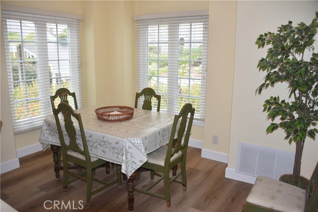 Kitchen table nook; either dining tables could be used as a workspace.