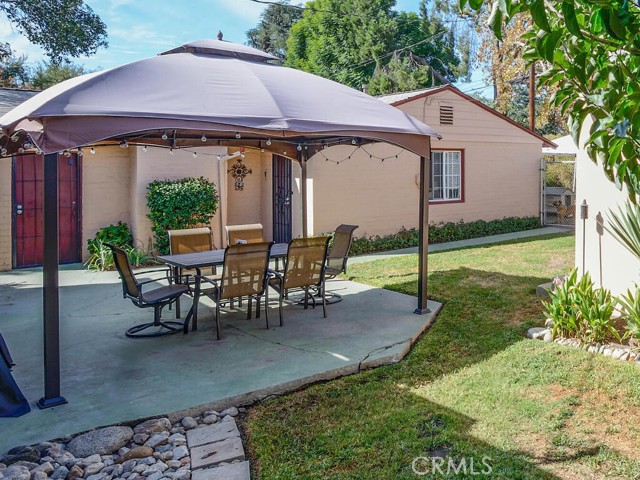 Rear patio and 2 entrances to guest home