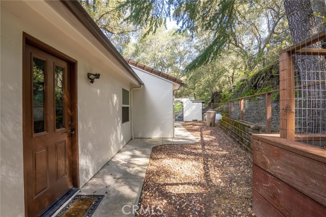 Access from the laundry room.  There is a walkway that will bring you around from the front.