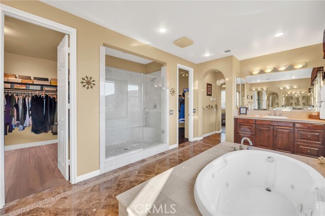 Primary bath with large 
 enclosed shower. (There are two walk-in closets on each side of the shower)