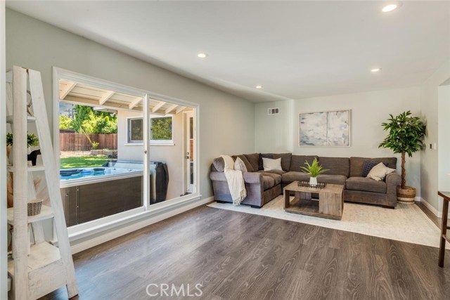 Living Room with Picture Window to Backyard