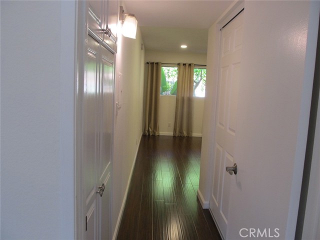 Hallway to primary bedroom