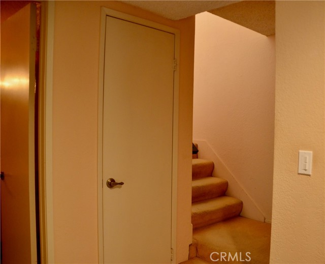 Entry leads to main floor bathroom and two closets and stairs to second level.