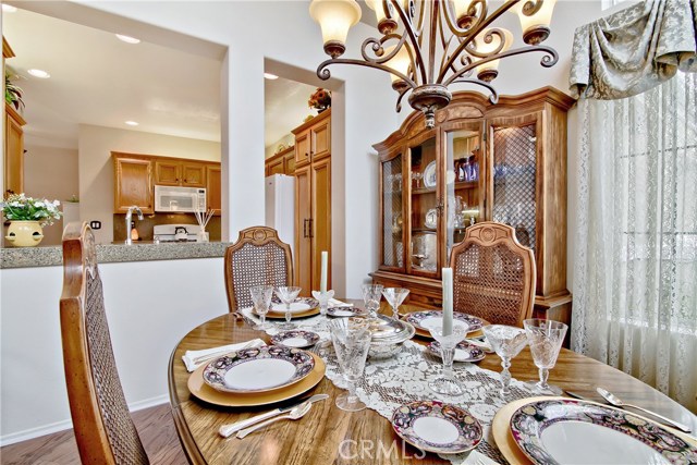 Formal dining room with open kitchen next to it.