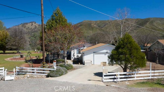 17145 Blueberry Way Clearlake Oaks, California Clean as a whistle! This 3 bed / 2 bath 1,300 SF manufactured home includes 3 parcels totaling nearly 1 acre of level land at the end of a quiet cul-de sac with outstanding mountain views! Enter the home to find tall ceilings throughout. Nice separation floorplan where master is opposite of the guest bedrooms. Indoor laundry + huge utility room for storage are a bonus! Kitchen has been updated with newer stainless steel appliances. Nice sized bedrooms and updated bathrooms lend to the charm of this home. Roof with 16+ years of life left in it, 3 year old water heater and upgraded plumbing throughout! Multiple exit options in case of an emergency! Wrap around deck with covered spa. 5 sheds for added storage. Property backs up to Casche Creek only 600 yards away! Several areas to enjoy serenity and relaxation at this one of a kind property. |O2o2xZepMqc