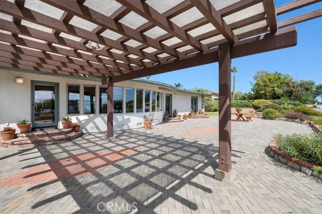 Outdoor patio with pergola, landscaping, pavers, BBQ, and views of the ocean and Catalina.