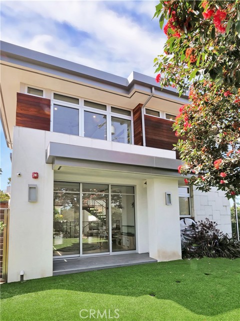 Grassy enclosed front yard.