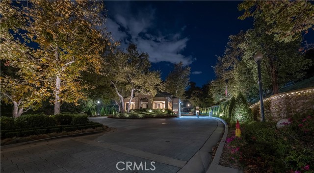 2496 Lancelot Lane Bel Air, California Harcourts Luxury Live Auction! Bidding to start from $8.5! Million Dollar Ocean Views, Million Dollar City Lights View, Million Dollar Bel Air Location with High Level Security and 24 Hour Guard Gated Community. This Beautiful Estate has had Over One Million Dollars spent in remodeling this home inside and out With Breathtaking Views and 5 Bedrooms That could be a 7 Bedroom and 6 Bath with aminor changes to the office areas. Your guest are greeted by the amazing Koi pond located at the front door and tucked into the trees as you walk across a bridge walkway. As you enter this amazing estate you step into an incredible entry with soaring ceilings and dramatic architecture. Incredible views from the Kitchen, Dinning Room, Breakfast area, Family Room, Bar and Yoga area as well as Master Bedroom and Guest Bedroom balconies. Large Glass doors slide away to open the California indoor outdoor living at it’s finest. Unbelievable Estate for entertaining. Luxury Resort amenities in the home include Steam shower, saunas and swimming pool and outdoor sitting areas with Incredible views everywhere you sit to relax and enjoy! Guest can walk from the home to the large entertainers back yard and pool area, while the views from all of this is again Breathtaking! Many Luxury Resort Style Amenities from Community Pool, Gym, Yoga Room and indoor Workout Rooms with Showers and Saunas. Fire places throughout this Beautiful Estate to cozy next to with a glass of wine, a luxurious bar area in the formal living room and just off the family room. Outside we have multiple lighted Tennis Courts and Basketball Courts with a very private Playground area set in a beautiful pine tree grove area. You will enjoy the private golf practice course with Putting Greens and Chipping areas with Incredible canyon and neighborhood views. Walking paths allow you to stroll around the private neighborhood as you stroll through beautiful trees enjoying amazing views in complete security knowing that your private security guards are driving the neighborhood. This Extraordinary Estate has been recently and beautifully remodeled with over One Million Dollars of incredible marble, granite, white sparkle quartz, espresso custom cabinetry and Gourmet Entertainers Kitchen with Stainless Steel Viking appliances. Also recently remodeled is the private pool and pool equipment, large patio areas along with a privacy fence was replaced with a private stucco wall for privacy & security. Starting Bid Price $8.5