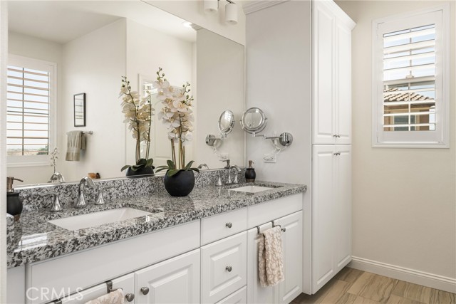 Elegant Dual Vanity with Granite Countertops