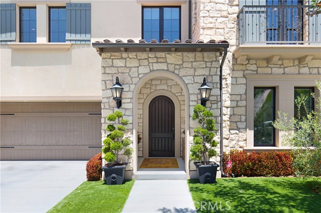 105 Gardenview Irvine, California NEW $130,000 PRICE IMPROVEMENT! Through the grand gates of Irvine's prestigious Hidden Canyon, escape into your private "Capri" Retreat - with a view from the Master Suite Deck! a fusion of luxury and comfort. You will relish the light and contemporary highly-upgraded home with +$700,000 in finishes, signature butterfly staircase, and oversize glass pocket doors, soaring high ceilings, and open floor plan like no other. This home features 4 bedrooms + office , 4.5 bathrooms and a spacious loft. A fabulous Gourmet Kitchen with oversized island and high-end appliances & popular second kitchen as well! Wolf/Asko/Sub-Zero. The large sophisticated Great Room off of the Kitchen features 24 foot open pocket door that transitions you into your outdoor entertaining space. The covered outdoor living space has a cozy seating area with a fireplace, multiple seating areas, built-in BBQ with beautiful trees for privacy. The downstairs offers a main level bedroom and full bath, and impressive office with a full-height stacking door that leads to a tranquil water feature in an open courtyard with retractable awning for shade and privacy.The extravagant Master Suite includes disappearing doors and outdoor deck with a VIEW. The master bath is beautifully upgraded with a freestanding soaking tub, grand walk-in shower and 2 walk-in closets. Fully Solar-powered Smart Home. Enjoy resort-style amenities, award-winning Irvine Schools, world-class shopping and dining, beaches, and trails.