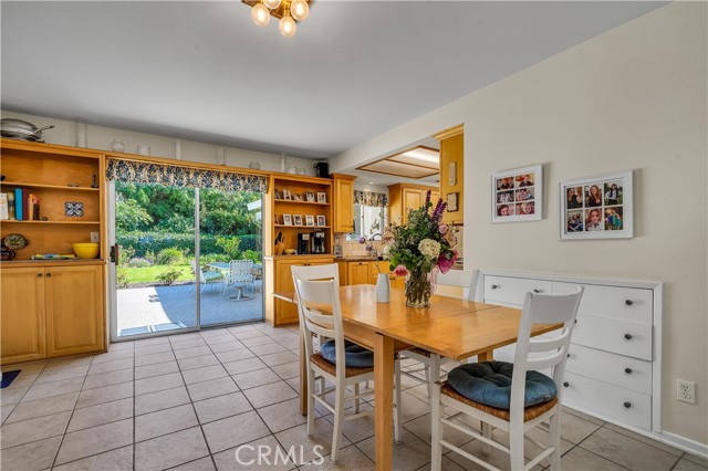 Another view of the dining area and a view of the spacious back yard