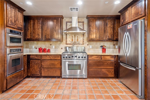 Large stove with 6 burners and a pot filler above, second oven and built in microwave!  Refrigerator stays!