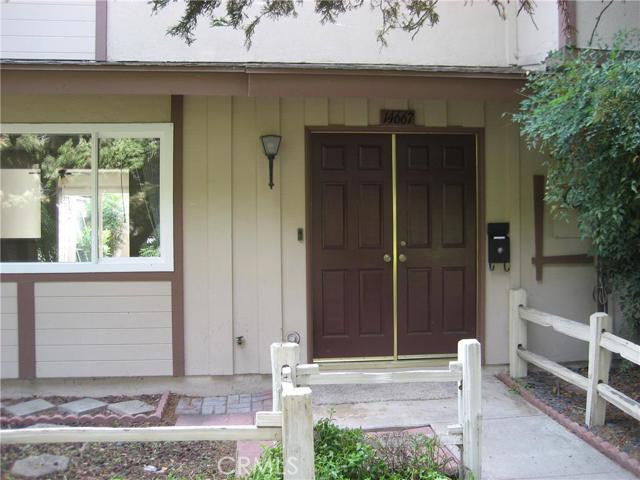 Welcome to your new home!   Spacious and recently remodeled!  This beautiful home has so many upgrades and is located in the highly desirable community of Tustin Greens.  Two story with three bedrooms and two and one/half baths.  Enter into the large living room, complete with cozy fireplace.  The kitchen has NEW appliances, tile floor and wood grain cabinets.   The dining space boasts a ceiling fan and has a sliding glass door to the patio, which leads to the two car garage.   The laundry room is off the kitchen as is the newly remodeled one/half bath.   New carpet flooring up the stairs and in all three bedrooms.  Both upstairs baths have been remodeled and are gorgeous!   The primary bath has a walk in shower; the hallway bath provides a tub/shower combination.  Double paned windows and sliding glass door ensure quiet enjoyment plus are energy efficient.  The garage has a pull down ladder with attic storage which is a very nice storage luxury.  In between the two car garage and the home, a new patio cover has been installed for outdoor enjoyment on the patio.  This property is a single family residence, and is attached only on one side.  There is a large community green grass area outside the front door, you will also enjoy the community pool, playground and sports court.   This home is conveniently located near fwys, shopping and surrounded by excellent schools.  Make an appointment to see it today!