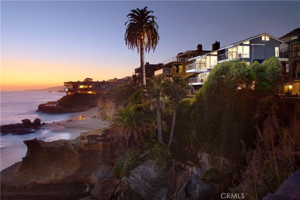 Unobstructed oceanfront views are just one of the countless rewards you'll enjoy at this extra-bright, newly remodeled residence in South Laguna Beach. The homesite is perched on cliffs above a rocky point of land and offers panoramic views of the Pacific Ocean, including breaking waves, sunsets over Catalina Island, and one of the few natural rock arches along the California coast. The main house features a four-bedroom, four-bath layout and provides private access to Table Rock Beach. A one-bedroom, one-bathroom casita adds an additional appx. 424 SF, bringing the total conditioned living space to appx. 3,361 SF. Built over five levels, this home is filled with natural light and boasts nearly 2,000 square feet of fabulous decks. Almost every room offers oceanfront decks and direct views of the Pacific. Mesmerizing sit-down ocean views embellish the entire main living area, where floor-to-ceiling windows and glass doors open to a wraparound deck with ample space for large-scale gatherings.

Indoor entertaining is equally impressive, thanks to a magazine-caliber kitchen with quartz countertops, ample cabinetry, an island with bar seating beneath designer pendant lights, and stainless-steel appliances, including a Bertazzoni six-burner cooktop and a KitchenAid refrigerator/freezer and dishwasher. The lofty ceilings continue into the primary suite, located on the main level, which includes an en suite bath with marble countertops, a spacious walk-in shower, and a bonus area that can be used as a walk-in closet. On the middle level, there is an additional bedroom with an en suite bath and a private balcony, a secondary bedroom, a full bath/powder room, and an oversized laundry room. The next level features a separate family room anchored by a fireplace, with sliding doors that open to a deck with awe-inspiring ocean views. The final level includes a full bedroom and bath that could be used as a home office. The two lower levels open to an enormous private deck overlooking the ocean. The detached casita, featuring a separate entrance off the courtyard, includes a walk-in shower and abundant natural light. The two-car garage and carport provide ample off-street parking. This home’s prime location is minutes from the Montage Resort and golf at The Ranch. Laguna’s Main Beach is only a short distance up Coast Highway, and Monarch Beach and Dana Point await to the south.