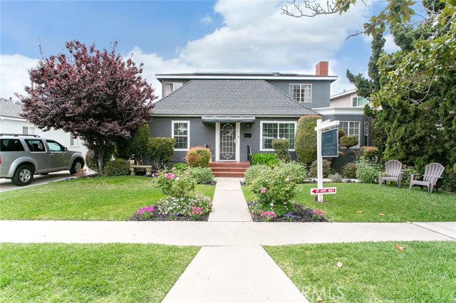 Manicured front lawn garden complements a gorgeous curb appeal!