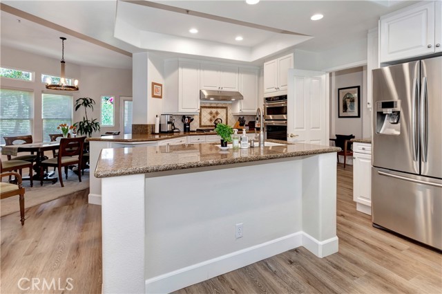 Kitchen with view of living room and trees