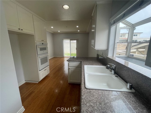 Kitchen looking into dining room and into the back yard