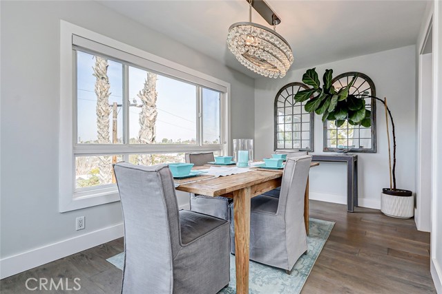 Fabulous entertaining formal dining room with ocean peeks and tree-top views!