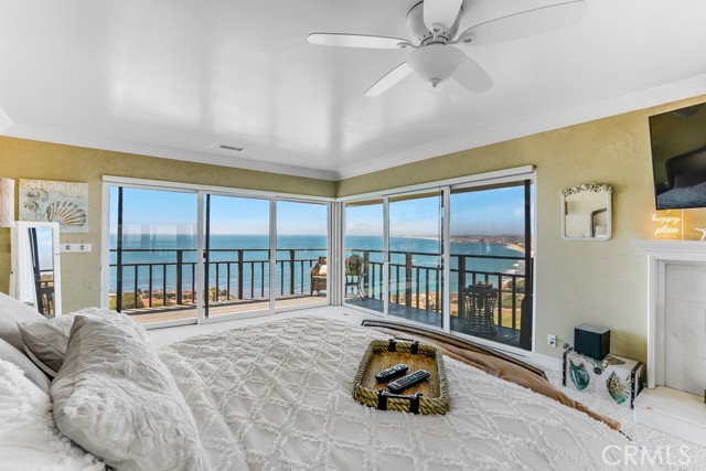 Master suite with private wrap-around balcony, fireplace, two closets