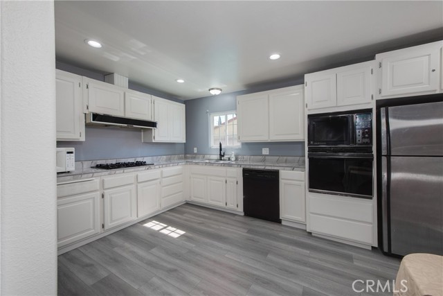 417 W Avenue L Calimesa, California WOW…PRICE REDUCED!!! WELCOME HOME!!! RENOVATED/UPGRADED POOL HOME! 3-CAR GARAGE! RV PARKING & HOOKUPS! ZONED R2! LG BONUS ROOM! This Gorgeous, Newly Renovated, Turn-Key, Pool Home is Centrally Located to Shopping, Restaurants and Freeway Close, with 3 bedrooms & 3 bathrooms...new interior & exterior paint and all NEW, High-Quality, Waterproof, scratch-resistant laminate Flooring throughout entire home. All 3 bathrooms have been remodeled with stunning features, which includes new, modern, anti-fog, color-changing backlit mirrors in 2 bathrooms with new marble top vanities, a new shower/tub combo in the hall bath. The master bathroom features an over-sized, marble/pebble, walk-in shower with a HUGE electronic RAIN SHOWERHEAD, which senses water temperature. Watch the colors change from blue to red depending on water temp. Kitchen boasts new plumbing fixtures, painted cabinetry, marble counter tops and recessed lighting. No expense spared in this updated renovation!! It doesn't end here...There is a HUGE Bonus room, an in-Door Laundry Room, Study/Office area and renovated 1/2 bath with a separate entrance from the patio and pool area, and another entrance from the back room. Did I mention the Pool Area? Yes, there is an in-ground pool, which is fenced for security. There is an updated patio cover--The patio is Perfect for Entertaining or quiet time to read a book. Yes, there's more...There is a 3-car detached garage with all new battery backup garage door openers. Ample parking with RV Parking & Hookups. New Roof installed over the main living space approx. 2 years ago. This home is located on a Lg. Corner Lot with a fenced front and side yard, and potential of enlarging the pool area for more backyard space if desired. Zoned R2 with ADU potential....The City of Calimesa is the New Up & Coming community, centrally located with rural living. THE FEATURES, UPGRADES AND AMENITIES ARE ENDLESS. COME SEE THIS BEAUTY FOR YOURSELF!