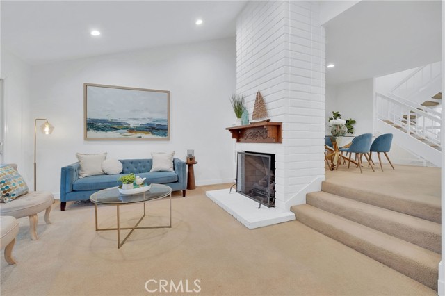 Living room with valted ceiling and gas fireplace