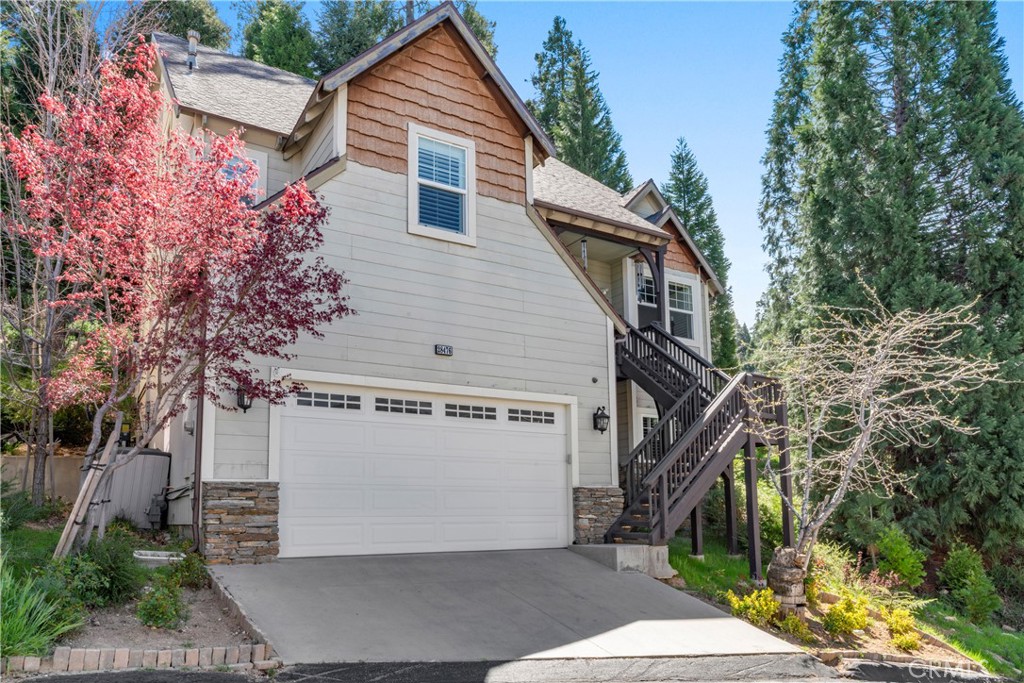 Arrow Canyon Estates- A secure and gated community walkable to Lake, Village, Dining and Shopping as well Close to Hwy. 18 to have access up and down mountain for commuting to work or play!  Within minutes you can be boating, skiing, biking, hiking, fishing, or riding the zip line at Sky Park.  Enjoy seasonal live entertainment within minutes! This home was custom built with upgrades throughout. Enjoy multiple dual sided fireplaces, a main level Primary with a giant walk in closet and dressing area.  4 bedrooms include 2 ensuites bedrooms with an upstairs common area family room is perfect for the second family!  Pristine condition with rear patio featuring a full entertainment area for indoor/outdoor living. Attached double garage provides storage and parking.  This gated community known as Arrow Canyon Estates is one of the biggest secrets on the mountain enabling any buyer to get the best value available be it full, part, or simply investment.