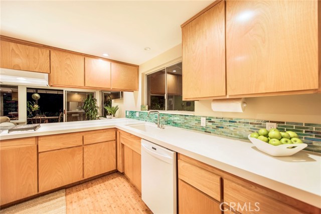 New cabinet doors, counters and glass back splash