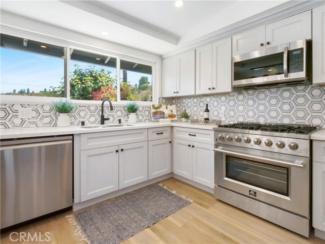 Kitchen with 6 burner Forno gas range and over