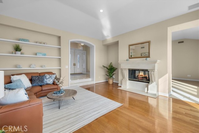 Family room with two-way fireplace to living room