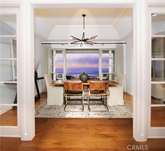 Spacious formal dining room with gorgeous views of the ocean and coastline