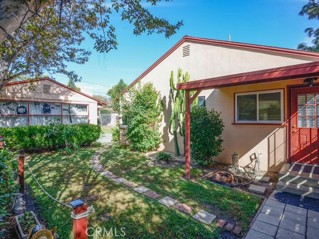 View of side yard off kitchen door and view of guest home