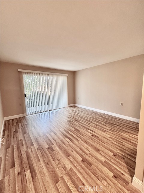 The primary bedroom is spacious, bright, and features brand new vinyl flooring.