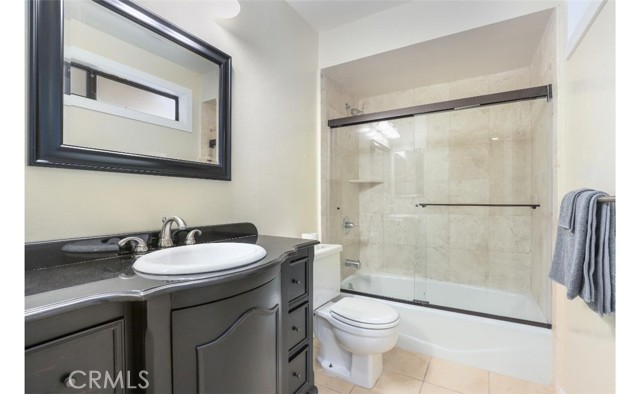 Junior Suite updated bathroom with Kohler shower glass enclosure.