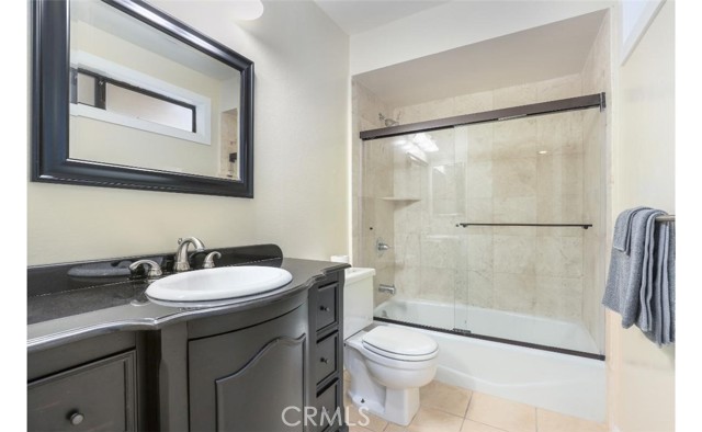 Junior Suite updated bathroom with Kohler shower glass enclosure.