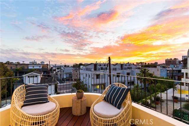 255 Main Street 305 Venice, California Welcome home to this stunning ocean-view penthouse located in the heart of Venice. This 2 bedroom home + an office, was designed & remodeled by award-winning architects Shubin + Donaldson, no expense was spared in this contemporary masterpiece. Newly refinished hardwood floors throughout, cathedral ceilings, & over-sized Fleetwood windows/doors. White water views from both levels! Tons of natural light fill the sprawling living room which boasts a stylish floating teak staircase, entertainment center with surround sound, plus a drop-down projector screen. The kitchen features Ann Sacks tile & top of line appliances; Wolf oven, Sub-Zero fridge, Miele dishwasher & in-unit washer/dryer. Loft-style primary suite w/ ocean & Malibu mountain views from almost every angle. Pamper yourself in the spa-like bathroom that's covered in imported Italian marble, then relax on your private sundeck—3 private patios (total) with an additional 260 sqft of outdoor space! Downstairs is a guest room w/ ensuite full bath. Office has views of the mountains & downtown LA. Fabulous location on the corner of Rose & Main! Great entertaining touches like the built-in humidor closet & wine fridge. Park your car in one of the 2 sides-by-side spots & explore all that Venice has to offer; a few short blocks to Abbot Kinney, Venice Beach, yoga studios, boutiques, high-end dining & more! Popular restaurants like Rose Cafe, and The Firehouse are literally outside your door! Community pool & spa, and storage. Upgrades include, but not limited to, fresh paint inside & out, refinished wood decks, new iron balcony railing, gas fireplace, flat screen TV, and new light fixtures... Don't miss this fabulous opportunity!