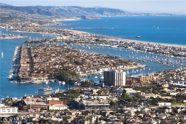 601 Lido Park Drive 7A Newport Beach, California You Have To See It To Believe It. The most beautiful condo in Newport Beach with the best view and ultimate lifestyle.
Design. Elegance. View.
Find yourself living in the sky with panoramic main channel harbor, ocean, mountain and city light views, in this exquisite and custom Lido Bay condo.
This 2 bed, 2 bath artistically conceived home features 1,873 square feet of natural light, refined hardwood floors, a chef-inspired kitchen with Caesarstone countertops, and unparalleled wood finishes and features. Outside, you’ll find a spacious balcony ideal for relaxing and internalizing an infinite amount of candied sunsets over Catalina Island. This sophisticated bay-front condo is located at the mouth of Lido Isle and within a world-renowned historic community, featuring fine dining and premiere retail in a bustling yet tranquil environment. A masterpiece of design, this upscale home is optimal for the active and independent spirit looking to impress, boasting a personal doorman, 24-hour security, private dock, immaculately maintained pool and spa, underground and guest parking, as well as a gym to keep you fit, and a stylish ballroom excellent for entertaining large groups. Elevate your lifestyle and explore the best of what Newport Beach has to offer in this one-of-kind, tailored-to-you condo.