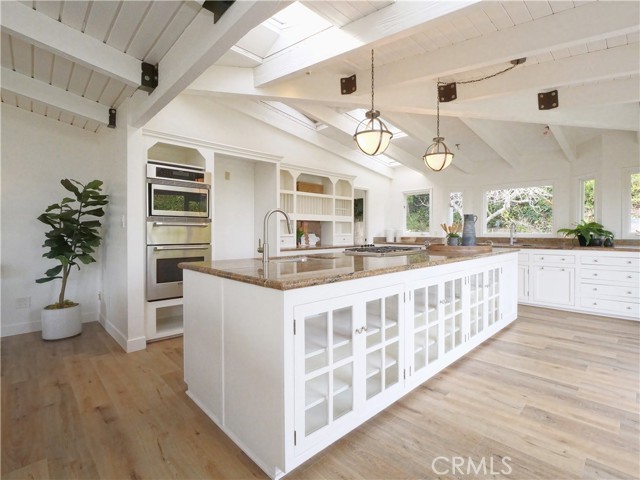 Kitchen view with large island with utility sink