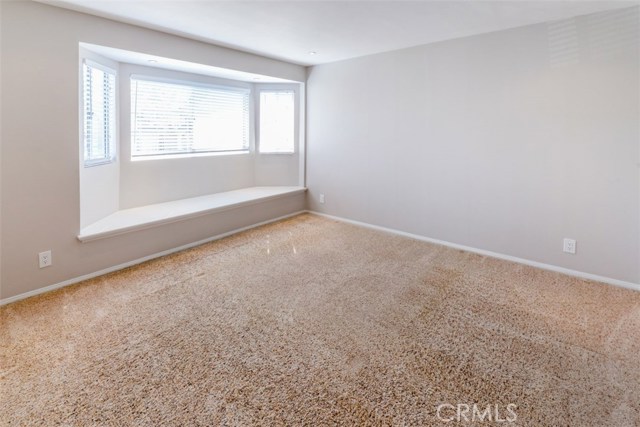 All four bedrooms plus office are upstairs.  This is the front bedroom facing the street with a full closet and window seat.