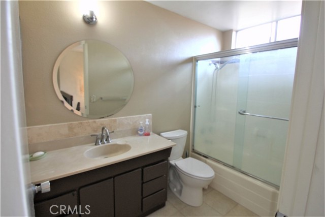 Hallway bathroom- shower over bathtub