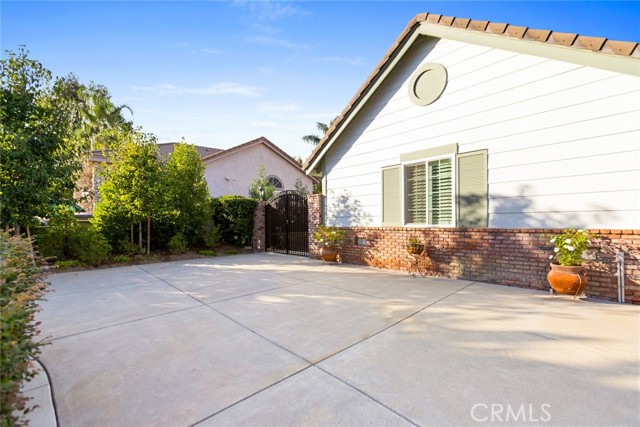 The seller has added an additional parking area that leads to a double gate. Depending on the size of your recreational vehicle the side yard offers even more parking!