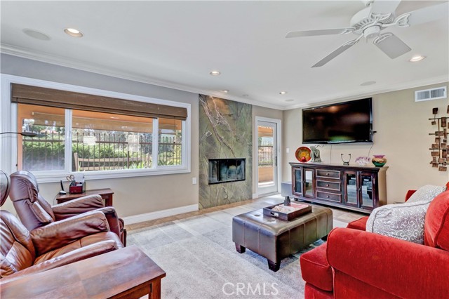 Living Room with Fireplace, Surround Sound & TV