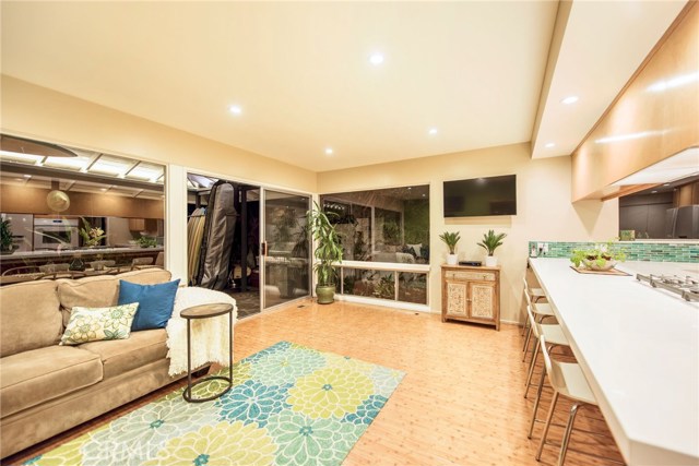 Large windows and slider that leads to the covered patio and yard